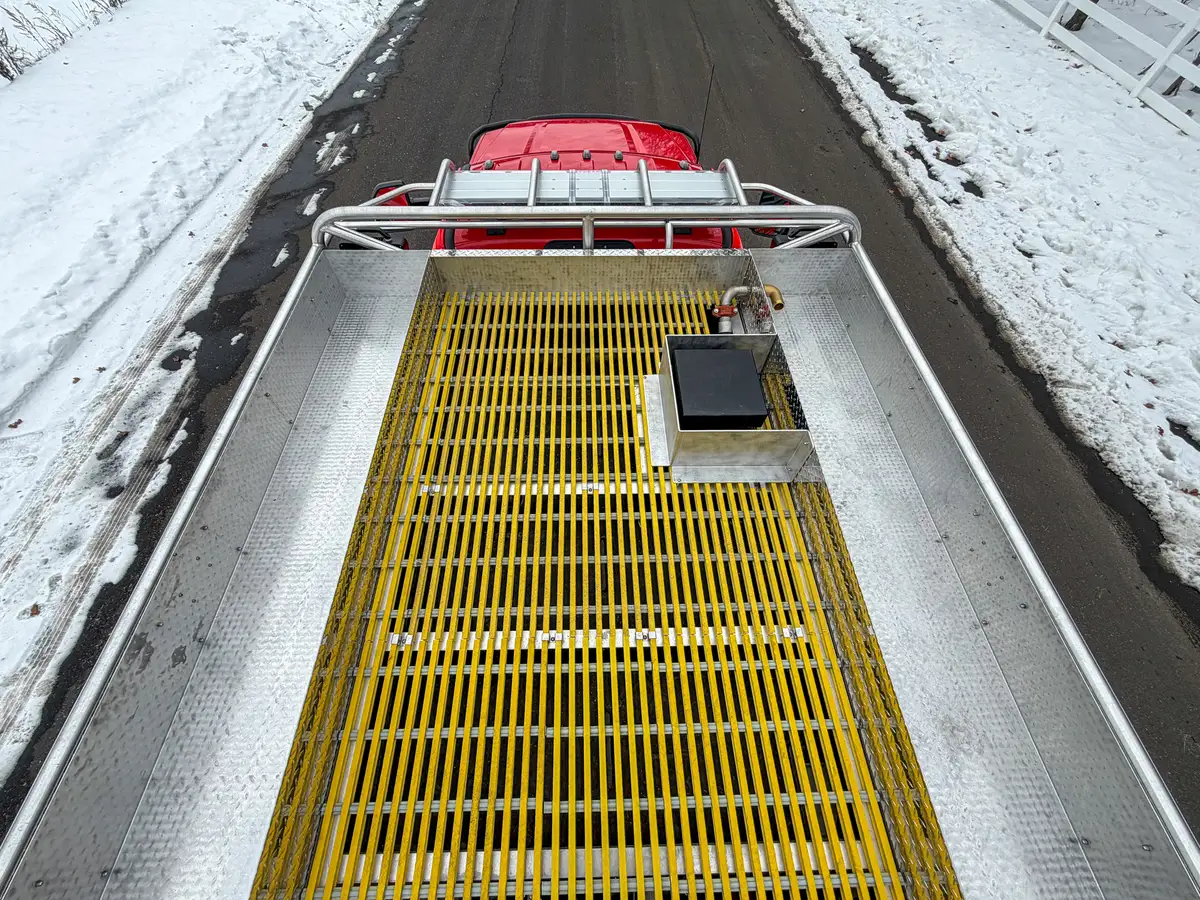 Top deck view over yellow grated walkway toward rear.